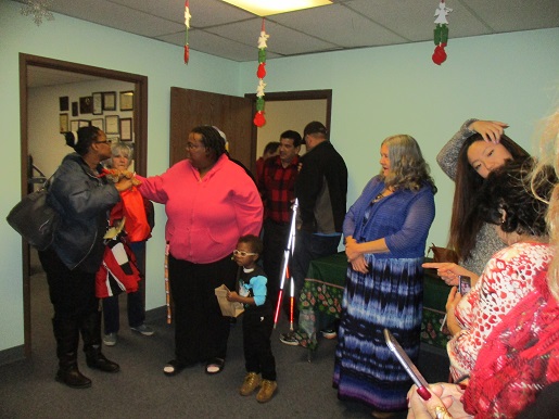 A group of people coming in to see Blind Santa